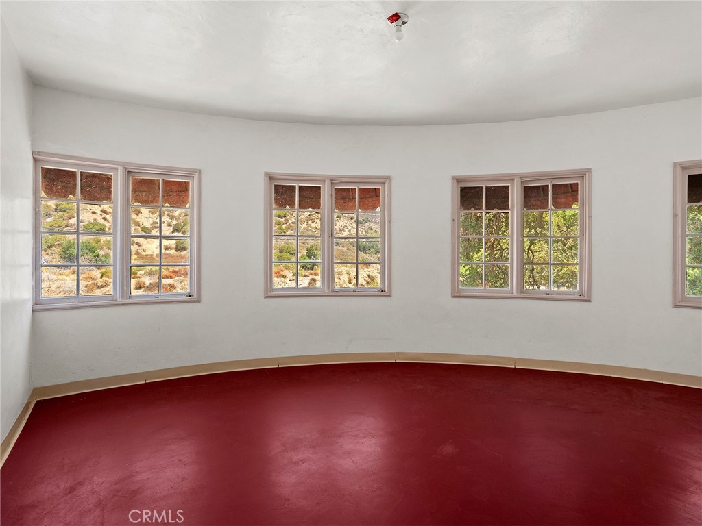 8618 La Tuna Canyon Road Sun Valley, CA 91352 - Photo 15 of 50 an empty room with wooden floor and windows