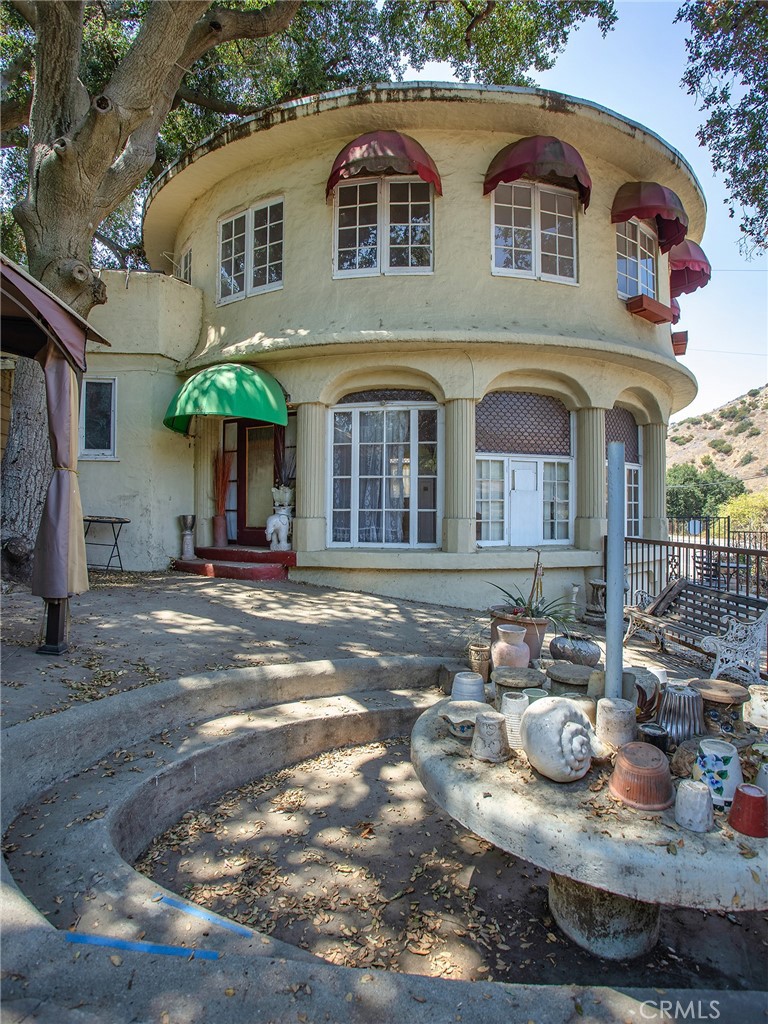 8618 La Tuna Canyon Road Sun Valley, CA 91352 - Photo 23 of 50 a front view of a house with barbeque and trees