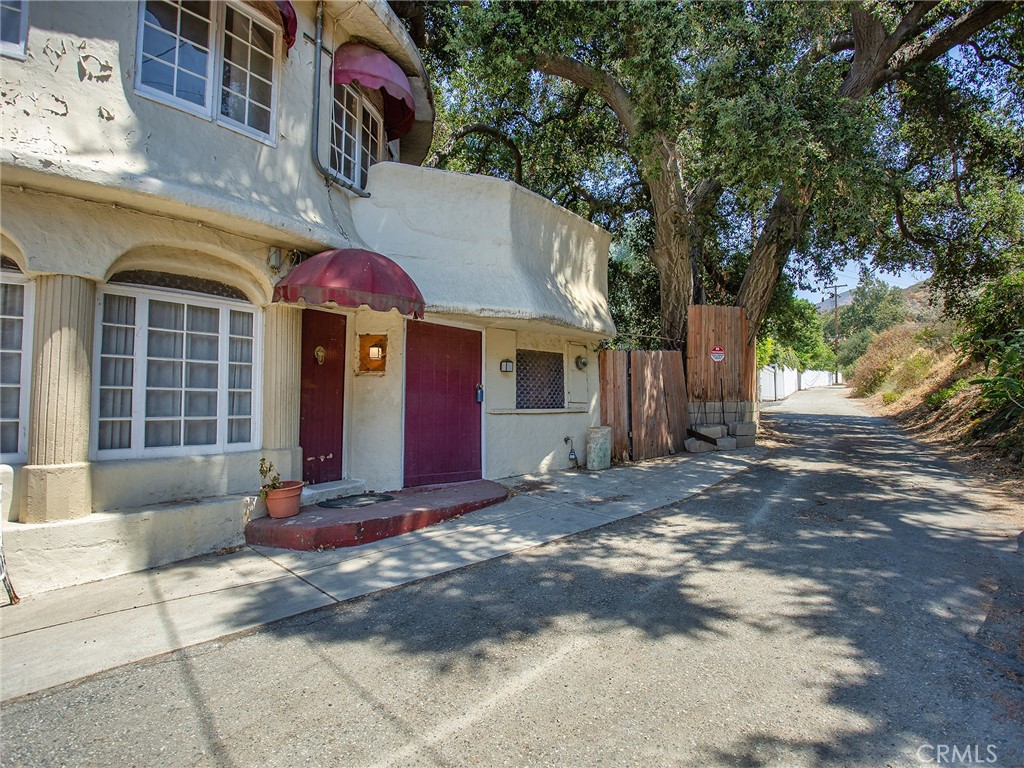 8618 La Tuna Canyon Road Sun Valley, CA 91352 - Photo 3 of 50 a view of a white house with a large tree