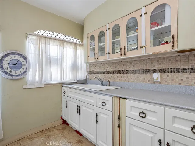 a view of cabinets and window