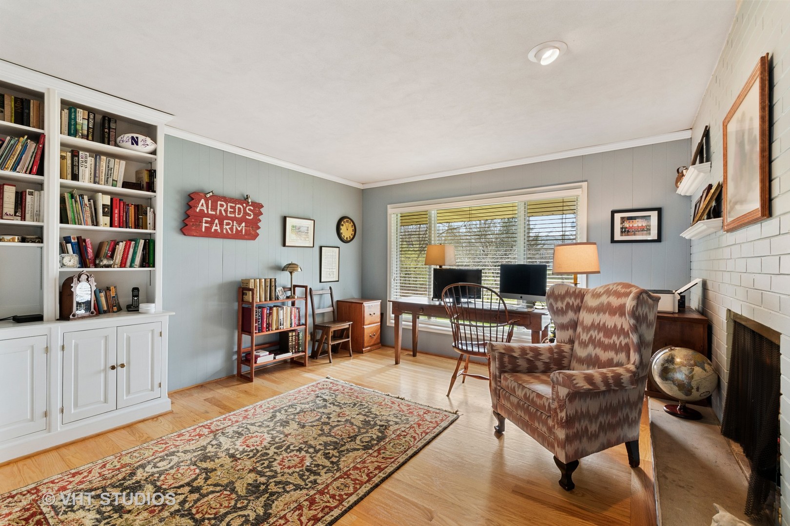 375 Maple Row Northfield, IL 60093 - Photo 11 of 38 a living room with furniture and a fireplace