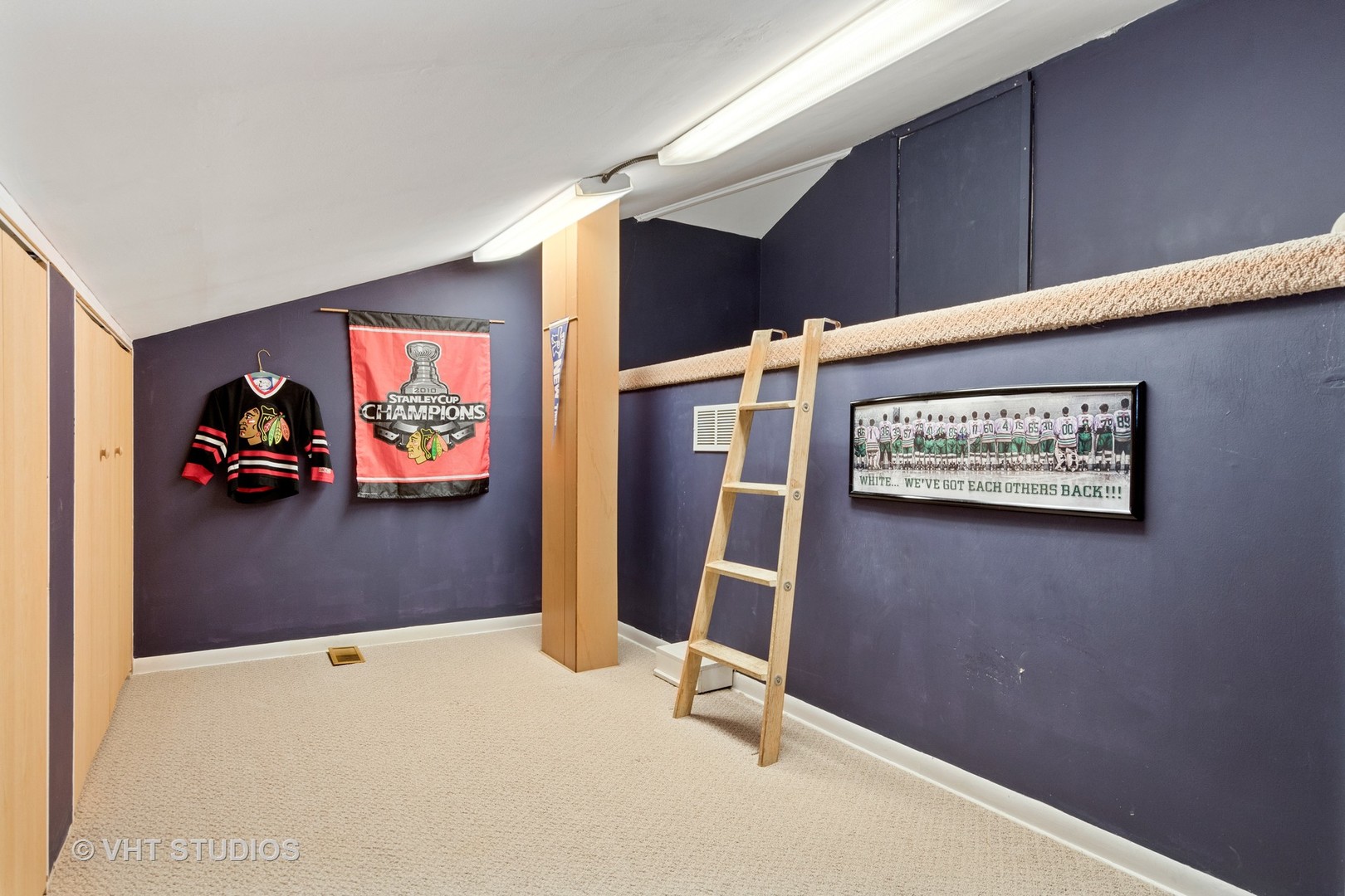 375 Maple Row Northfield, IL 60093 - Photo 23 of 38 a view of a hallway with paintings on the wall