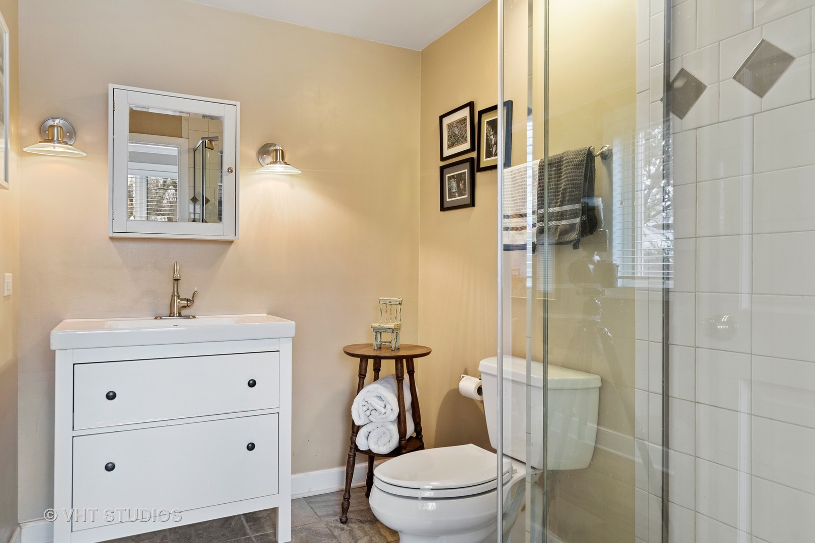 375 Maple Row Northfield, IL 60093 - Photo 26 of 38 a bathroom with a toilet sink vanity and mirror