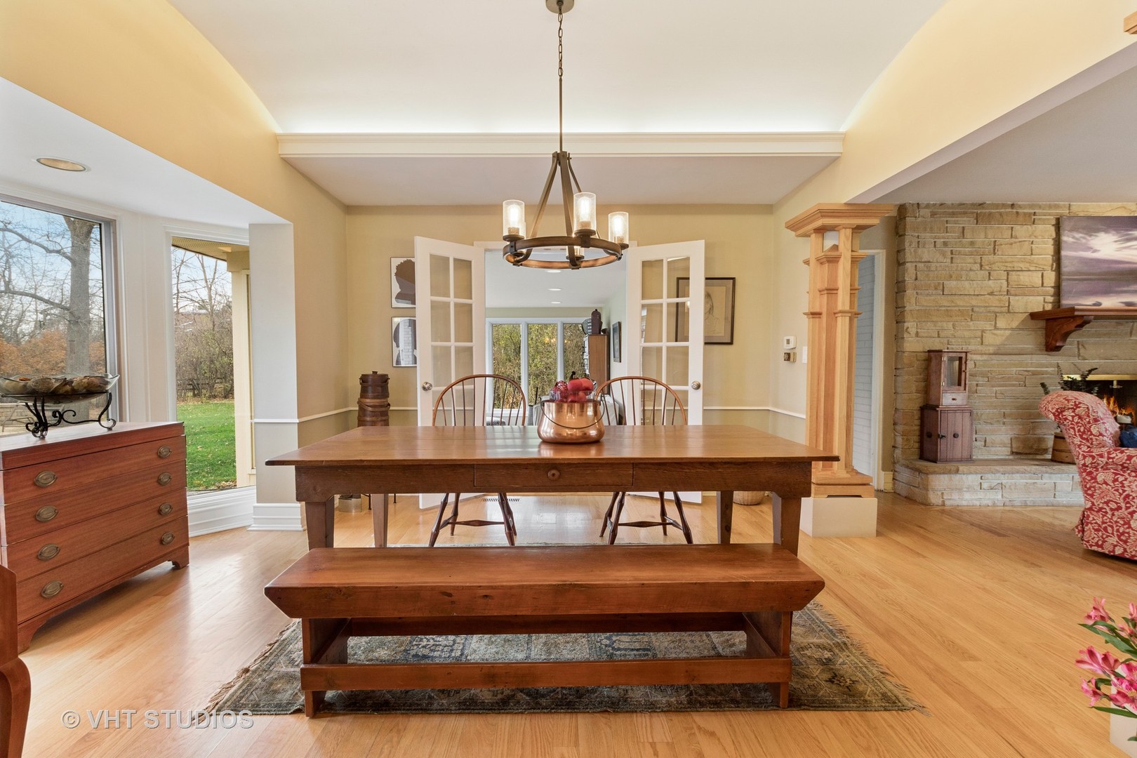 375 Maple Row Northfield, IL 60093 - Photo 9 of 38 a view of a dining room with furniture wooden floor and chandelier