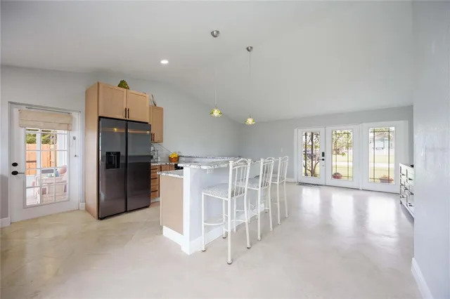 a view of work space with wooden floor and windows