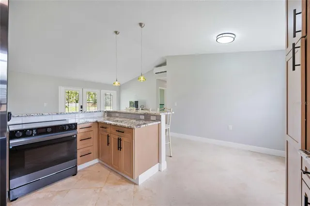 a kitchen with a stove and a sink