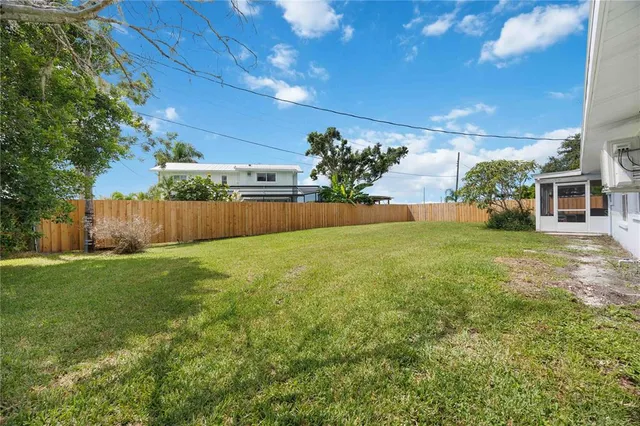 an aerial view of a house with a garden