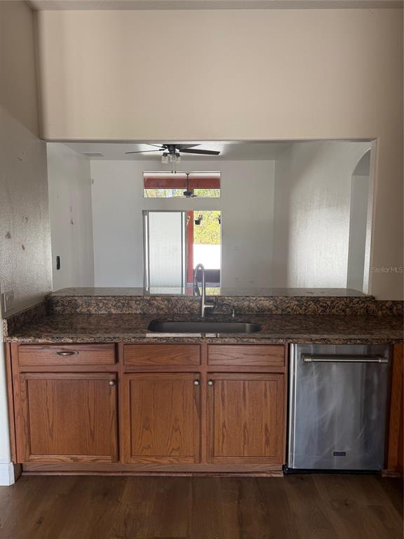 3020 Norlina Street Deltona, FL 32738 - Photo 11 of 30 a kitchen with granite countertop a sink and a stove