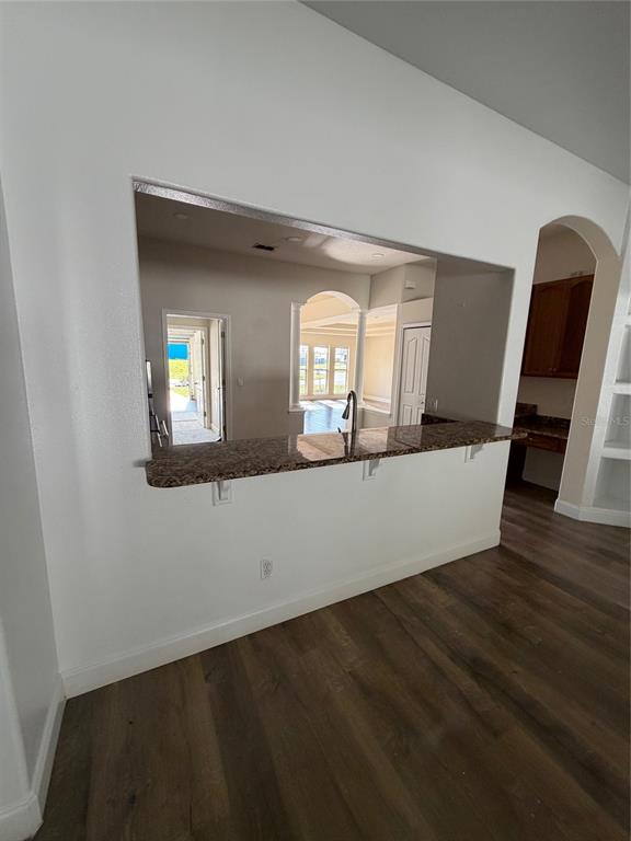 3020 Norlina Street Deltona, FL 32738 - Photo 19 of 30 a view of an empty room with wooden floor and a window