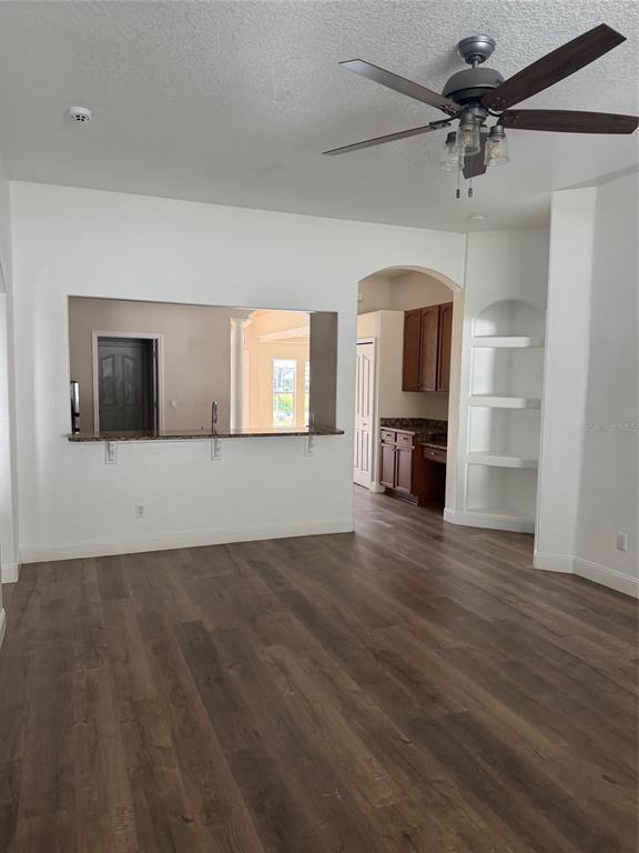 3020 Norlina Street Deltona, FL 32738 - Photo 27 of 30 a view of a livingroom with wooden floor a ceiling fan and a window