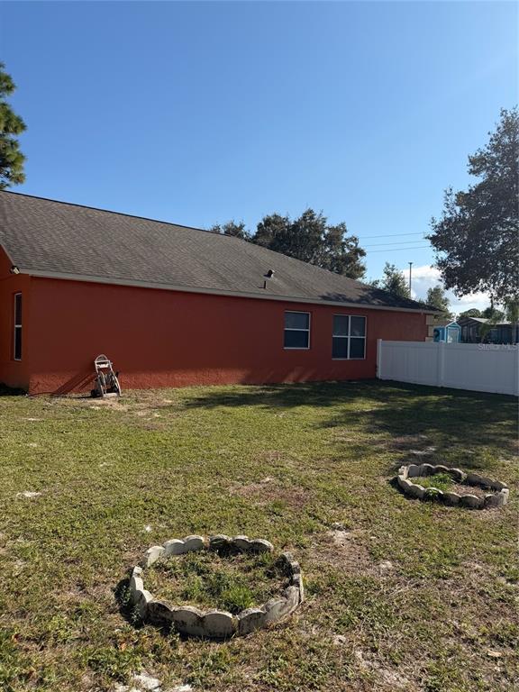 3020 Norlina Street Deltona, FL 32738 - Photo 30 of 30 a backyard of a house with lots of green space