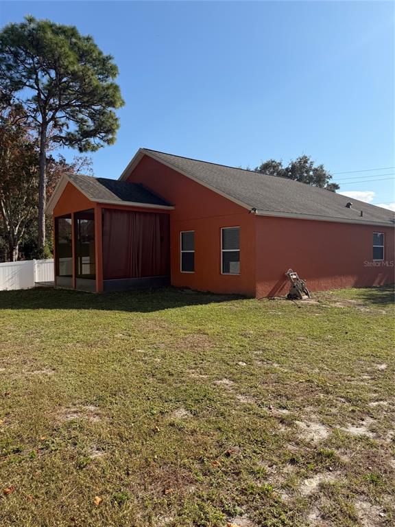 3020 Norlina Street Deltona, FL 32738 - Photo 4 of 30 front view of a house with a yard