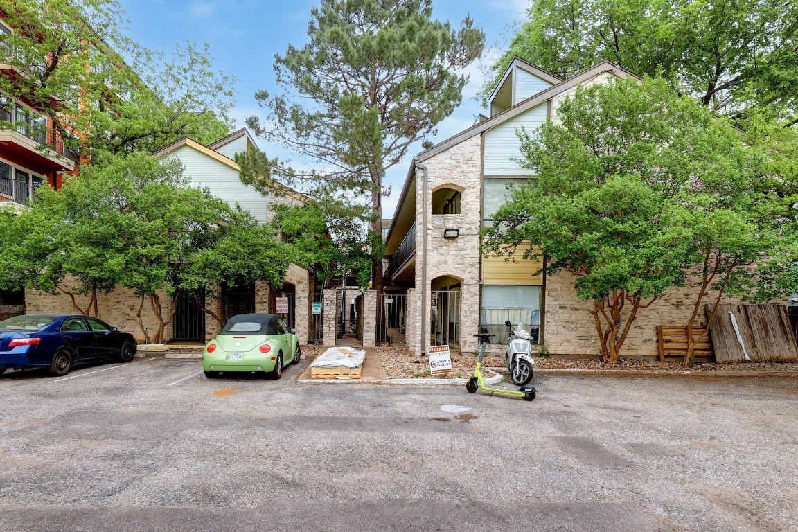 a view of a car park in front of a house