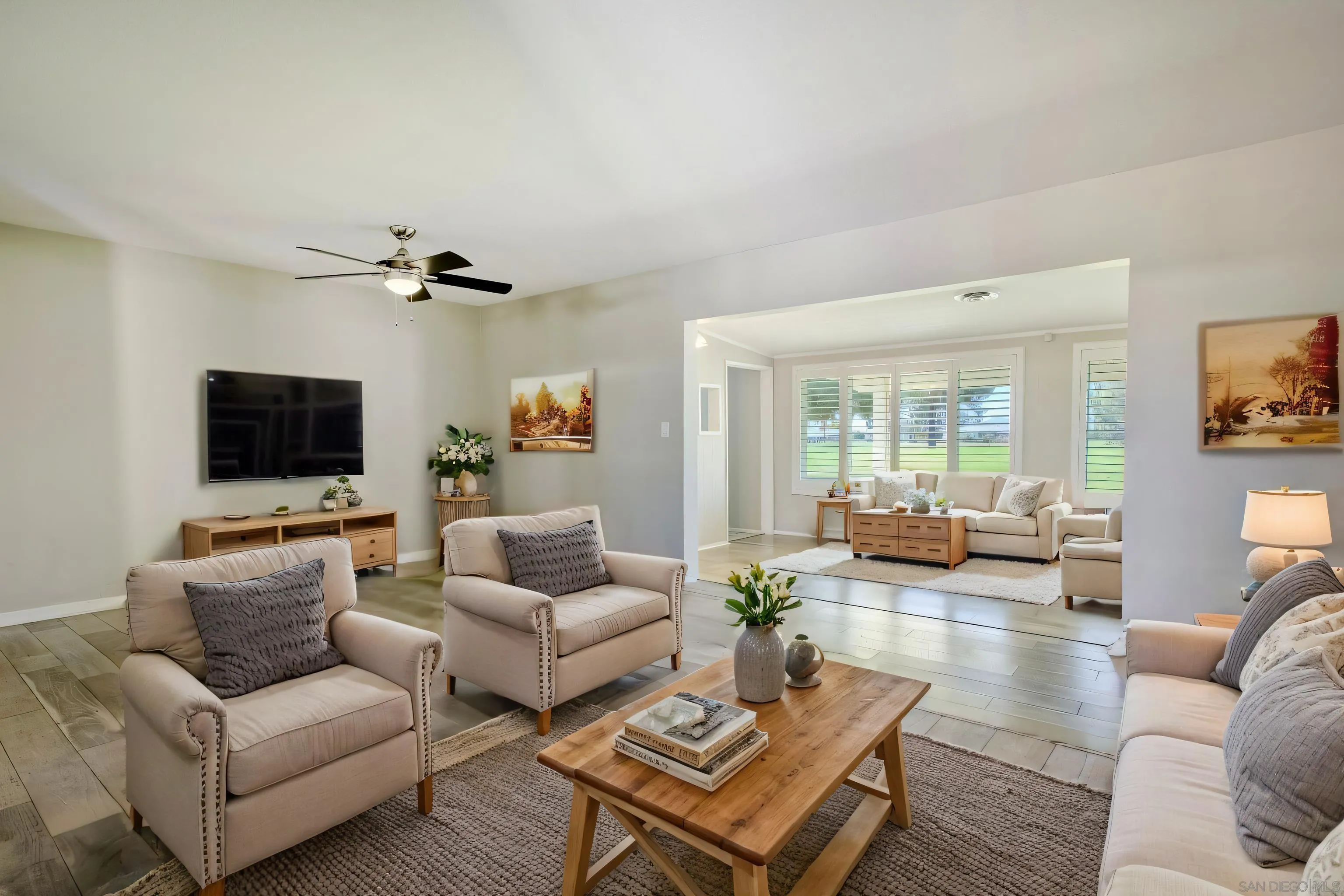 26055 Cherry Hills Boulevard Menifee, CA 92586 - Photo 1 of 31 a living room with furniture and a flat screen tv