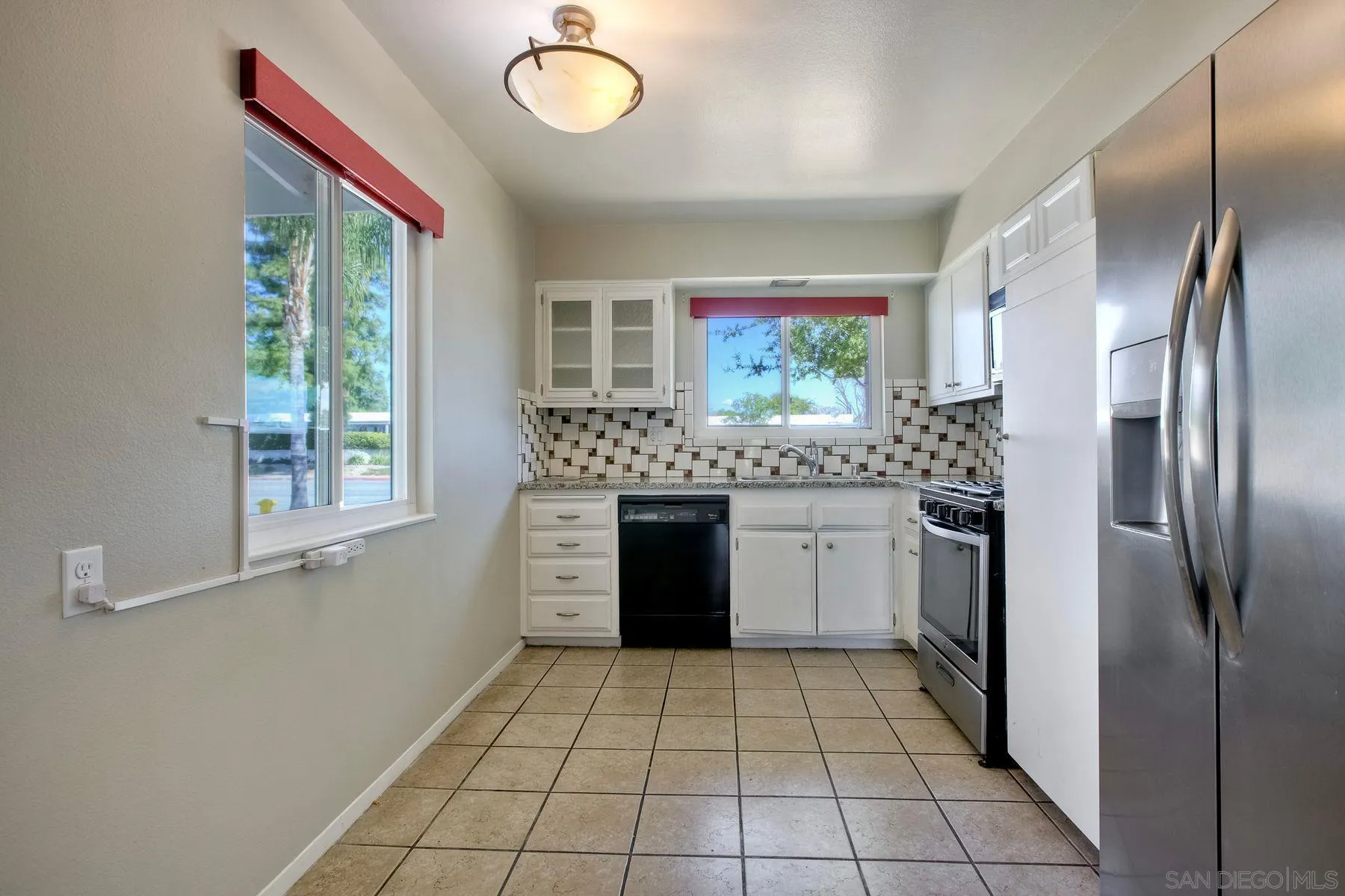 26055 Cherry Hills Boulevard Menifee, CA 92586 - Photo 14 of 31 a kitchen with stainless steel appliances granite countertop a refrigerator and a stove