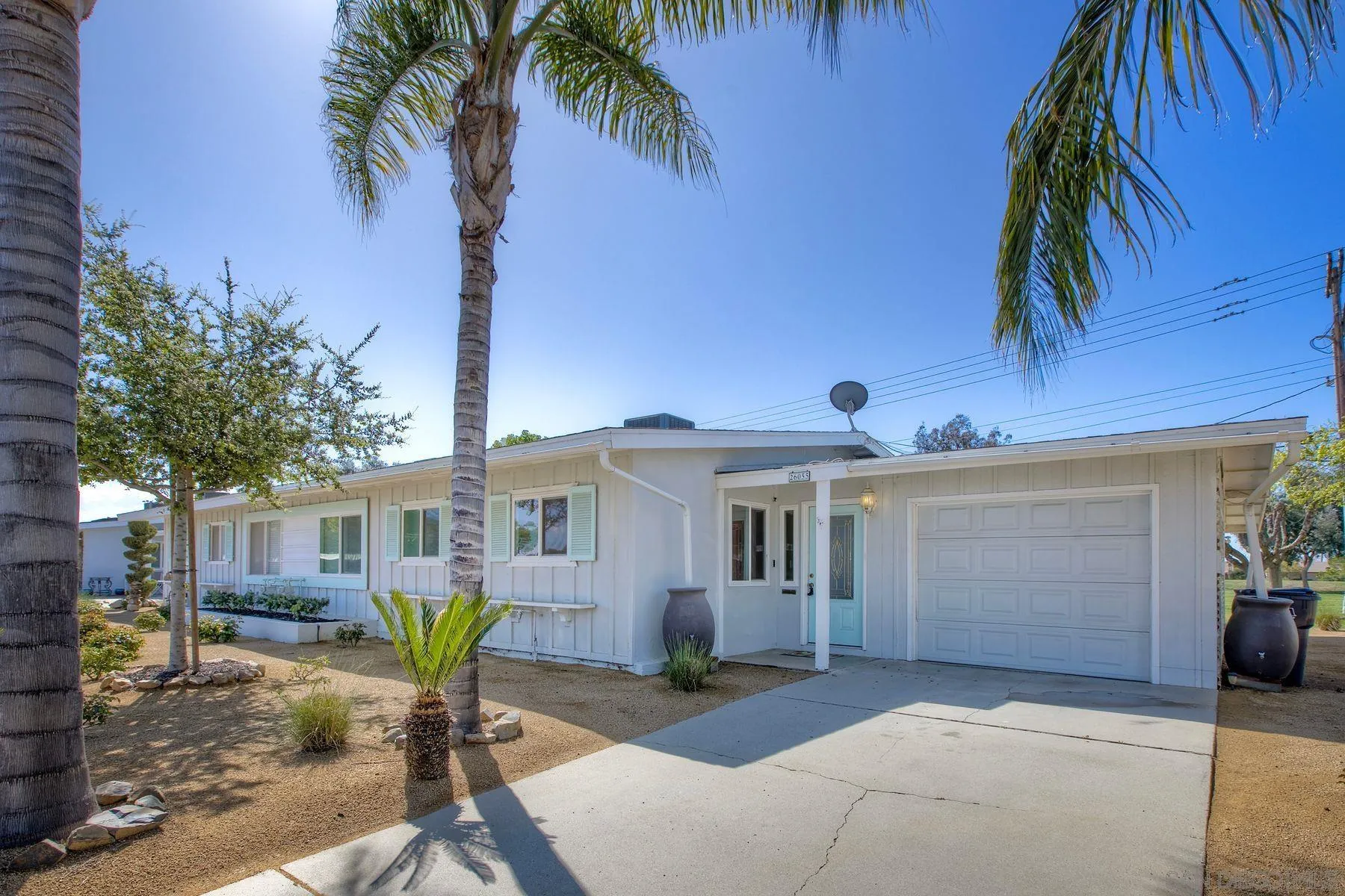 26055 Cherry Hills Boulevard Menifee, CA 92586 - Photo 2 of 31 a view of a house with a patio