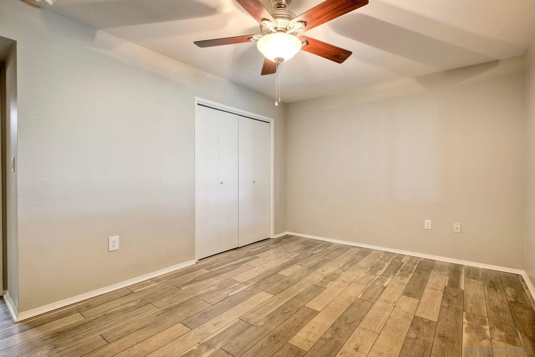 26055 Cherry Hills Boulevard Menifee, CA 92586 - Photo 23 of 31 wooden floor in an empty room
