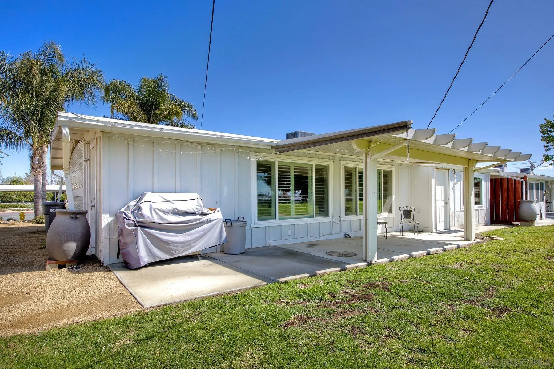 26055 Cherry Hills Boulevard Menifee, CA 92586 - Photo 28 of 31 a front view of a house with patio
