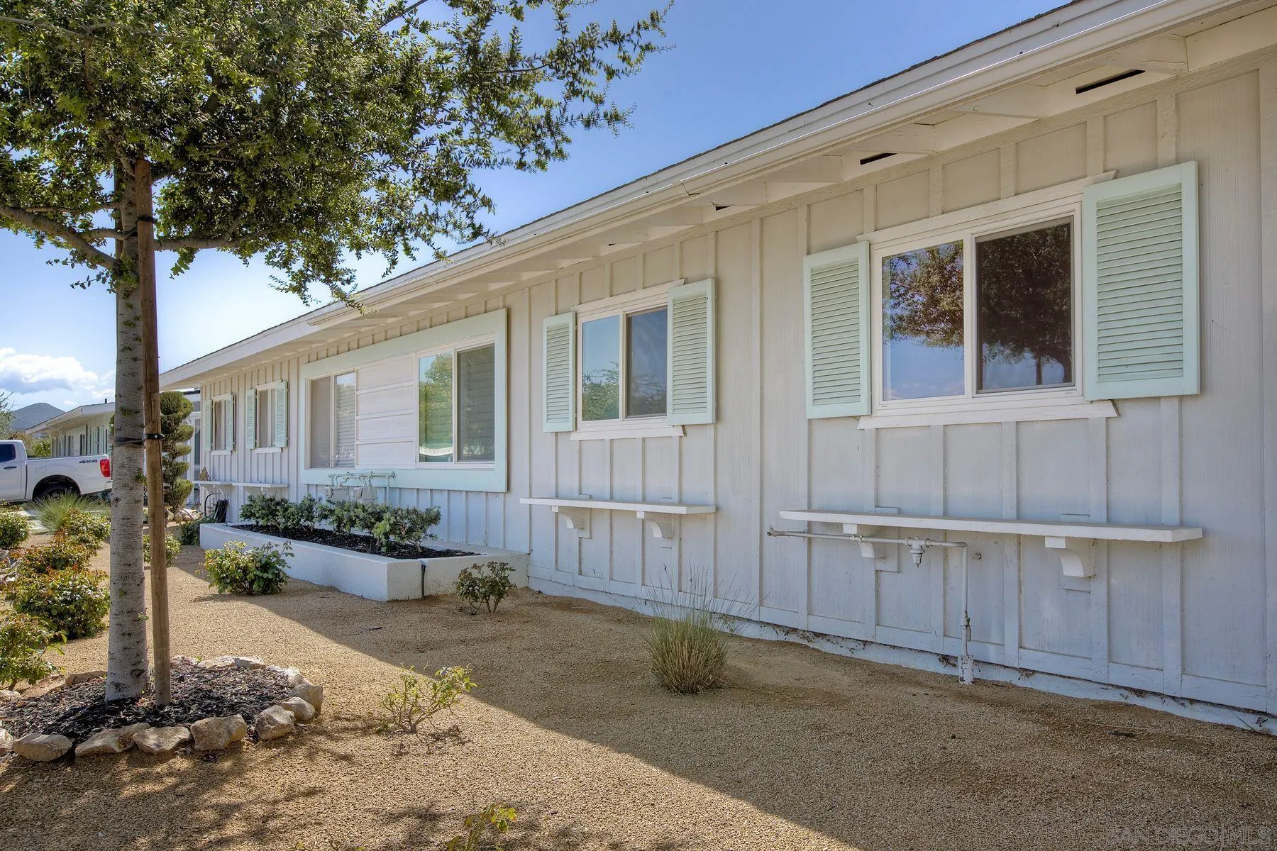 26055 Cherry Hills Boulevard Menifee, CA 92586 - Photo 31 of 31 a front view of a house with garden