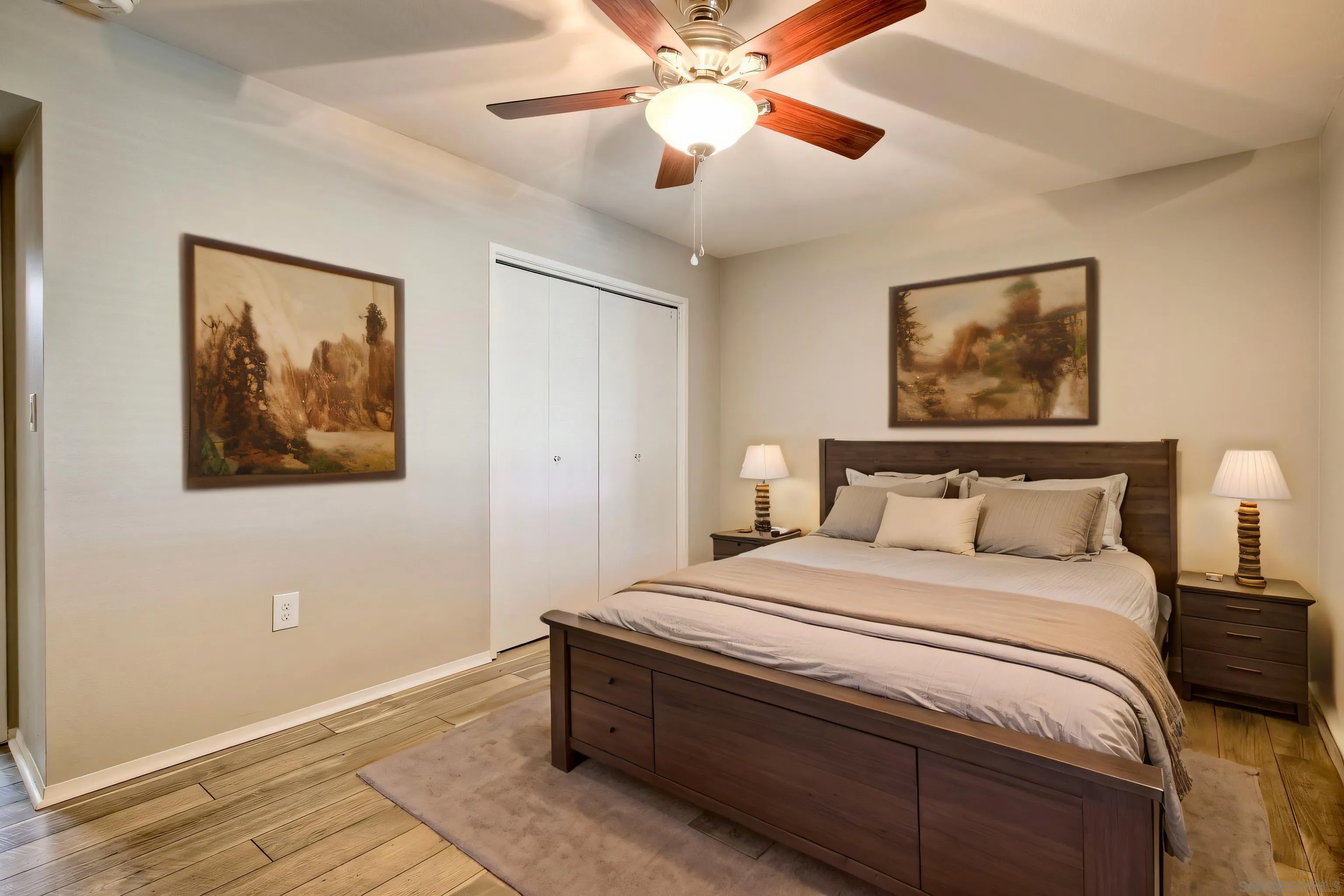 26055 Cherry Hills Boulevard Menifee, CA 92586 - Photo 8 of 31 a bedroom with a bed and a painting on the wall