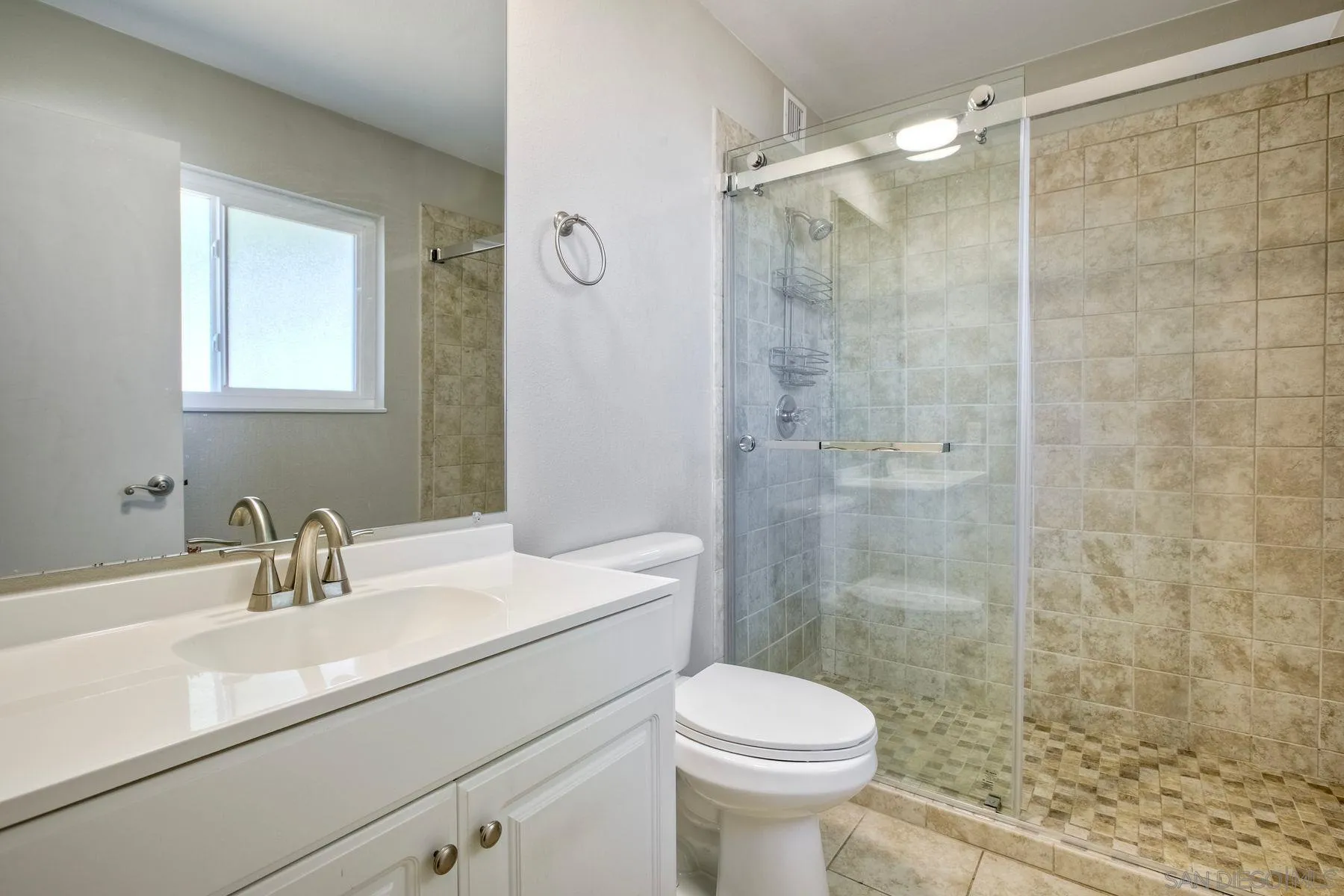 26055 Cherry Hills Boulevard Menifee, CA 92586 - Photo 9 of 31 a bathroom with a sink a toilet and shower