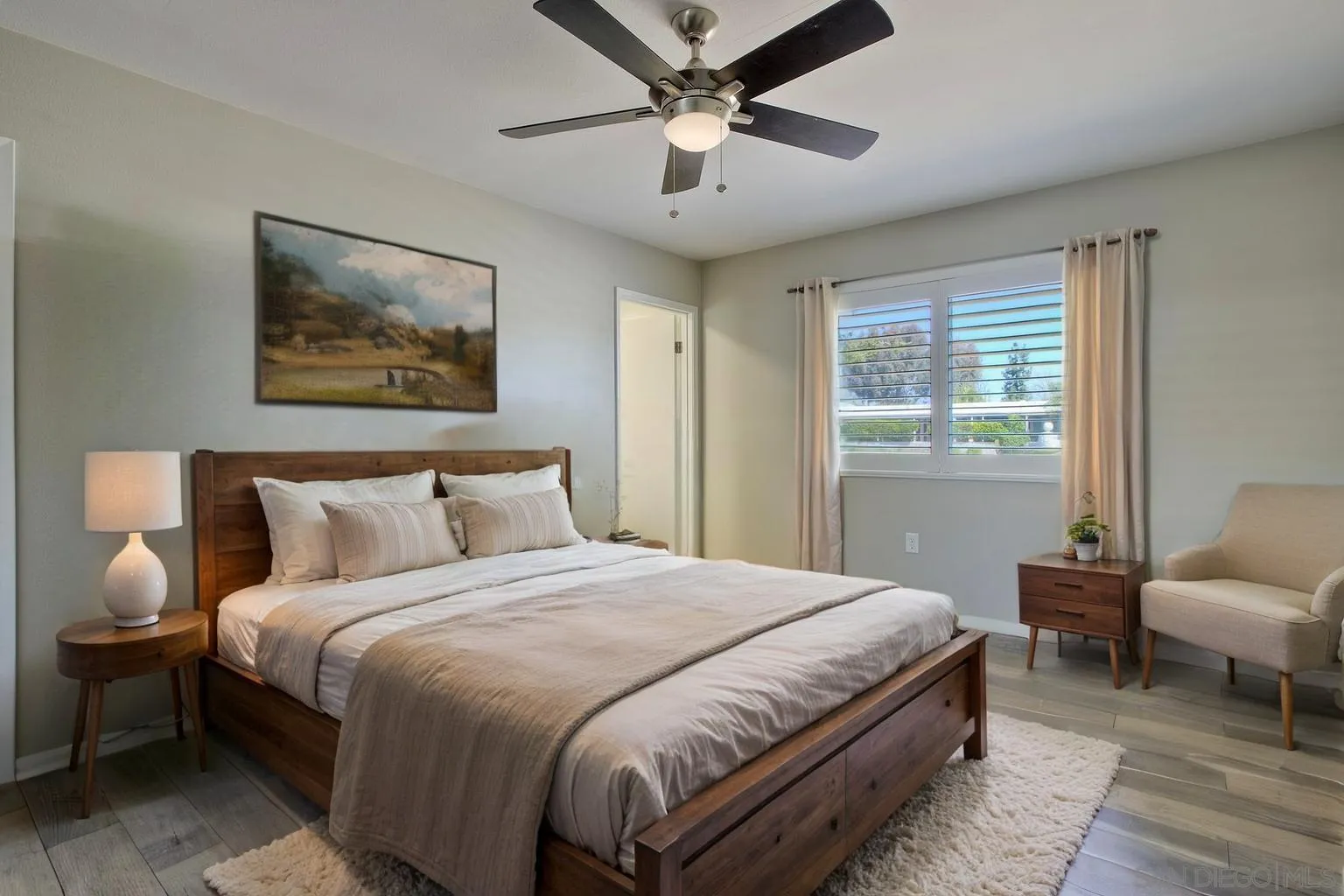 26055 Cherry Hills Boulevard Menifee, CA 92586 - Photo 10 of 31 a bedroom with bed and a couch