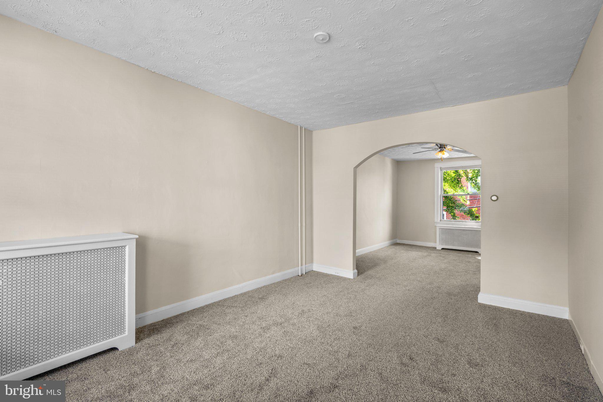 3703 Belair Road Baltimore, MD 21213 - Photo 4 of 30 Neutral Carpeted Living Room and Dining Room combo