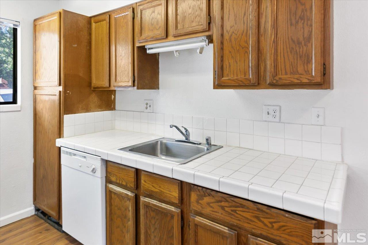364 Wheeler Avenue Reno, NV 89502 - Photo 5 of 11 a kitchen with a sink cabinets and a window