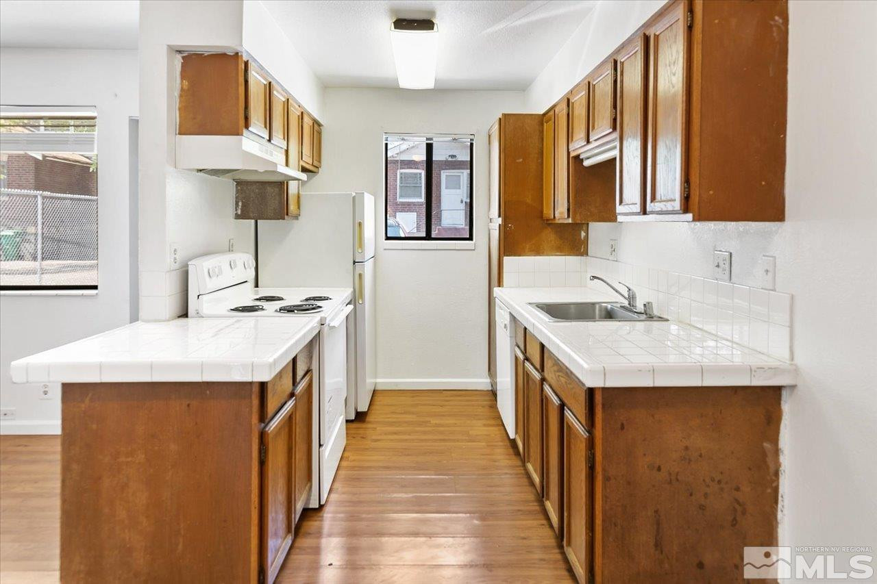 364 Wheeler Avenue Reno, NV 89502 - Photo 6 of 11 a kitchen with a sink stove and a refrigerator