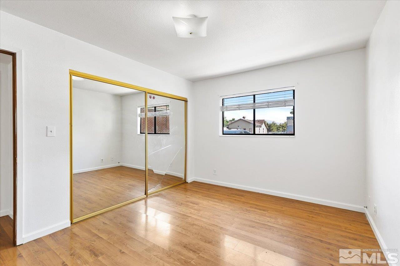 364 Wheeler Avenue Reno, NV 89502 - Photo 9 of 11 a view of empty room with wooden floor