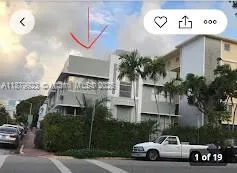 a view of multiple houses with a street