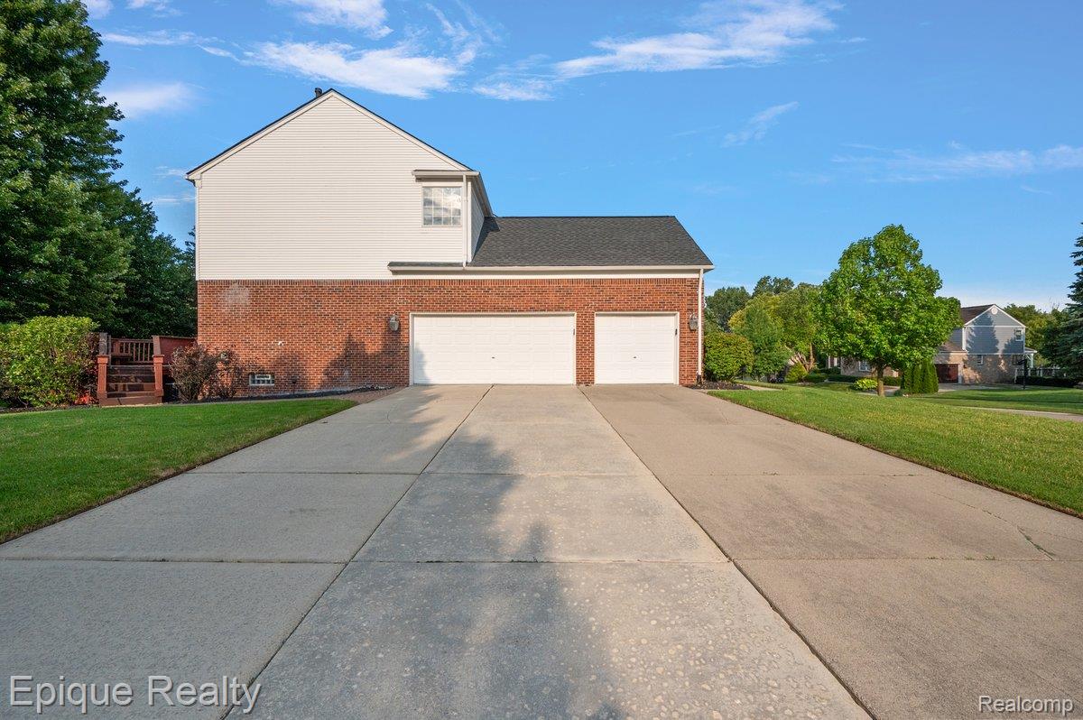 Brick and siding exterior with a two-car garage