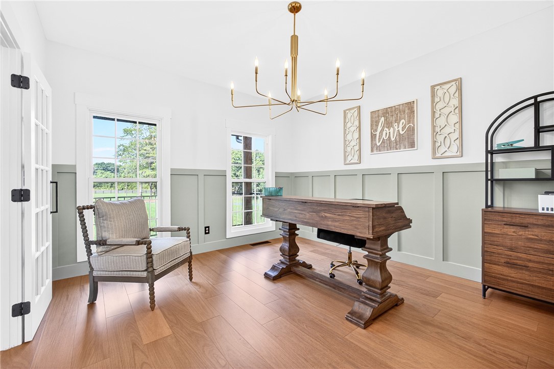 5016 Copeland Road Belton, SC 29627 - Photo 8 of 45 An inviting study with wood flooring and abundant natural light perfect for focused work or quiet contemplation.