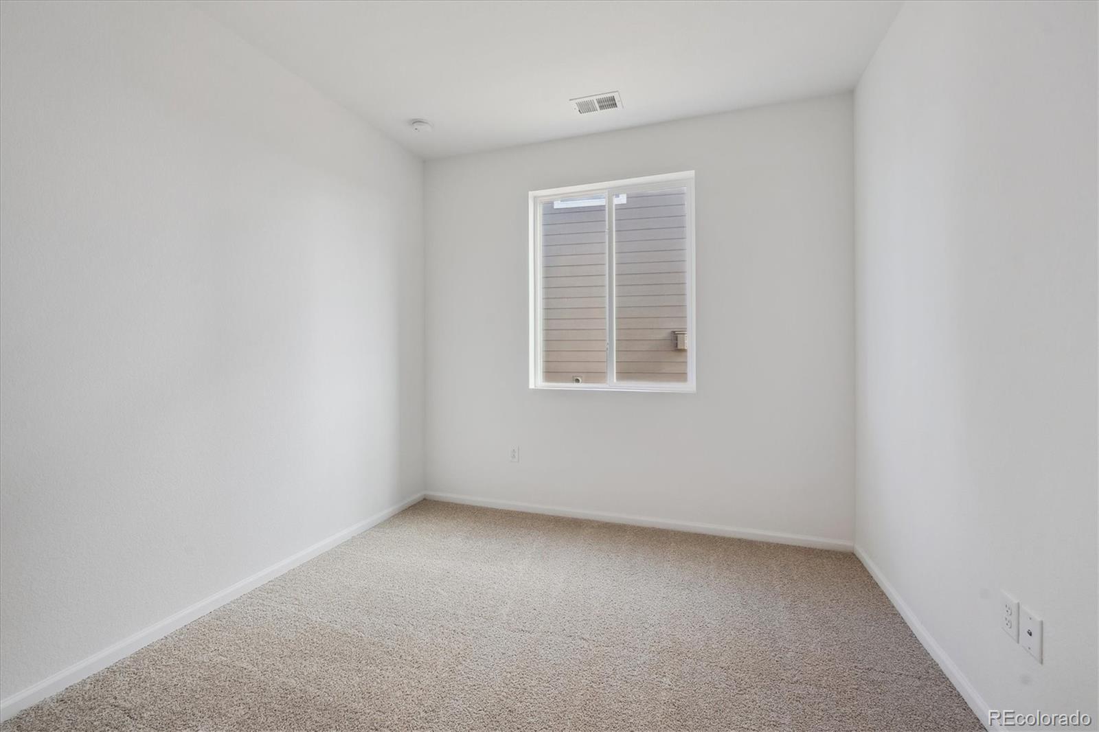 6122 Amerifax Drive Windsor, CO 80528 - Photo 14 of 21 an empty room with a window