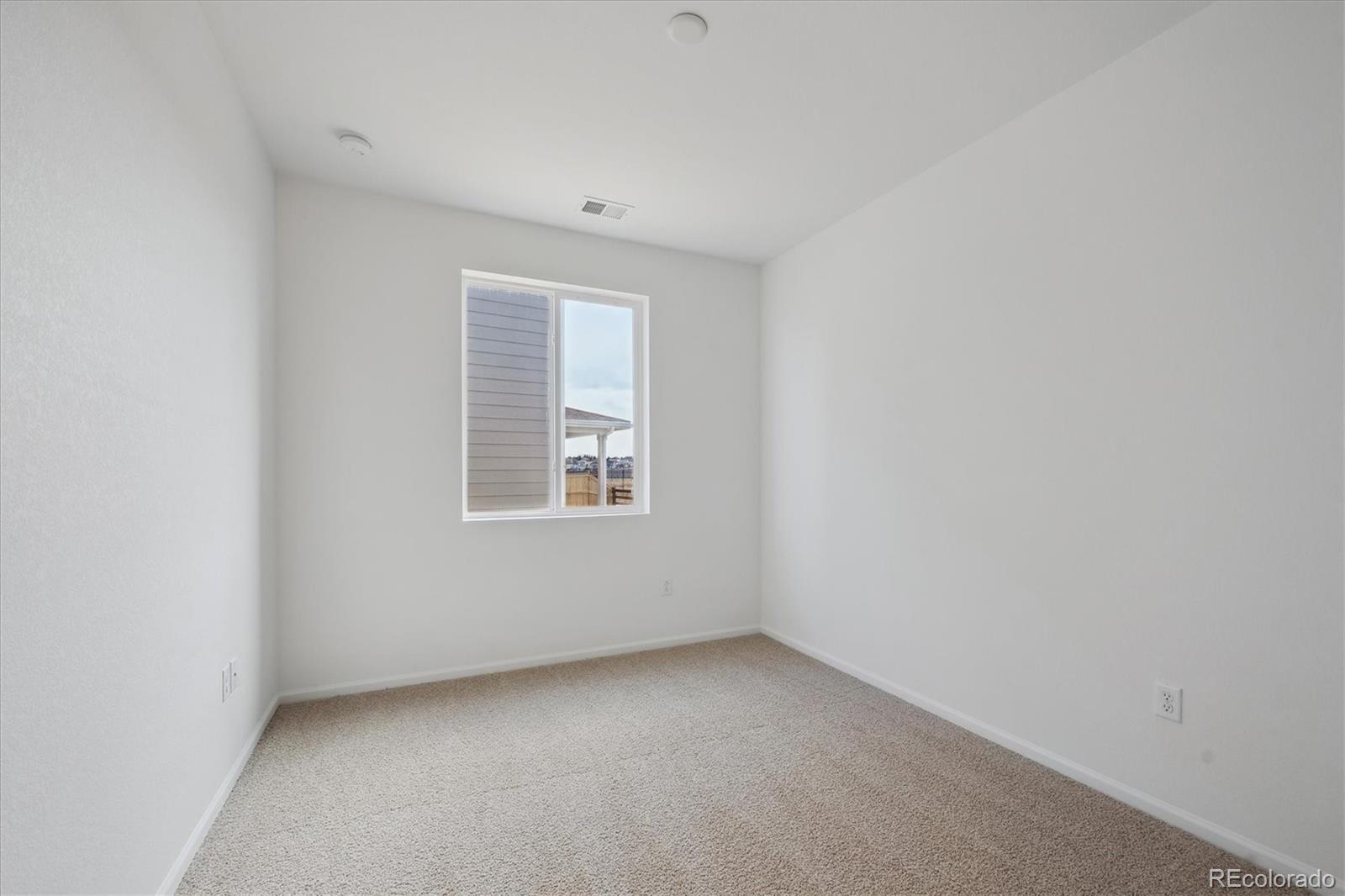 6122 Amerifax Drive Windsor, CO 80528 - Photo 17 of 21 an empty room with a window