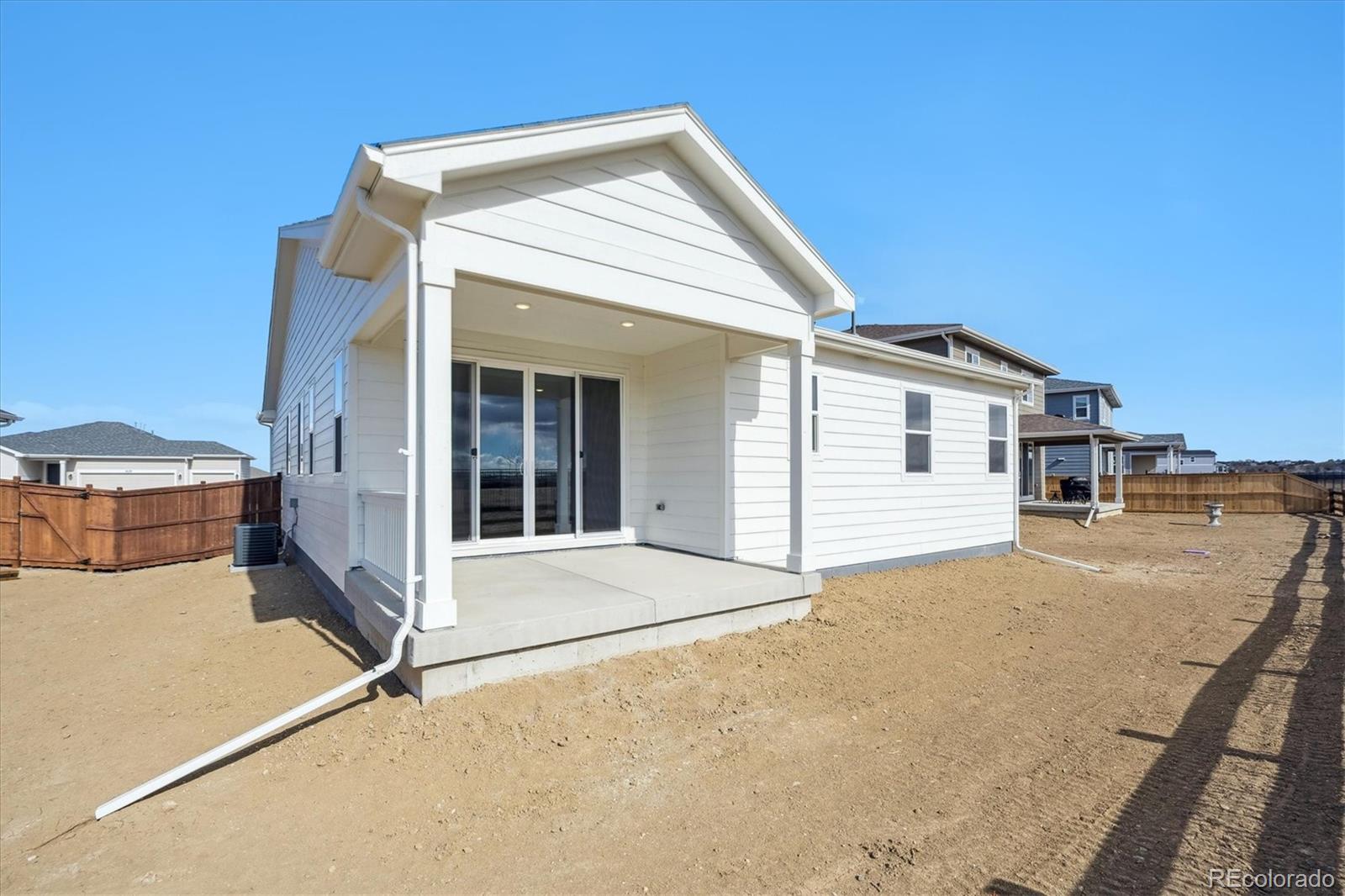 6122 Amerifax Drive Windsor, CO 80528 - Photo 20 of 21 a view of house with backyard and parking