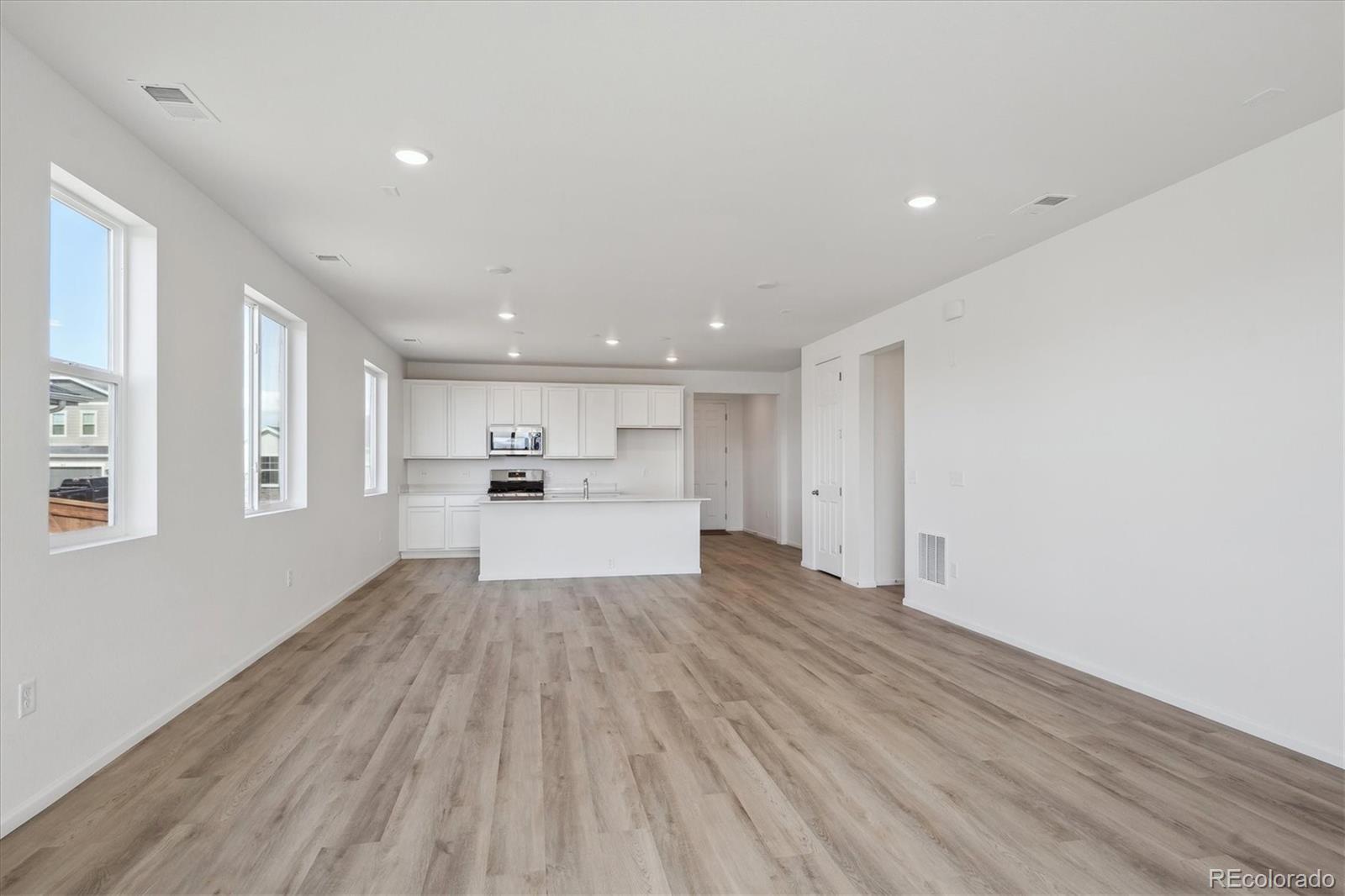 6122 Amerifax Drive Windsor, CO 80528 - Photo 9 of 21 a view of kitchen with wooden floor