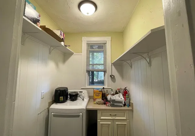 a bathroom with a sink a washer and dryer