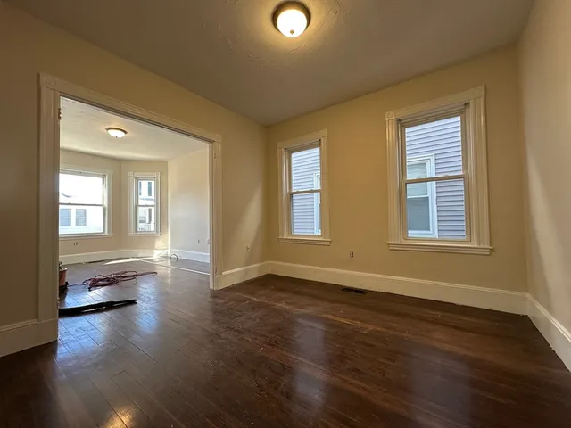 a view of livingroom with hardwood floor and a window