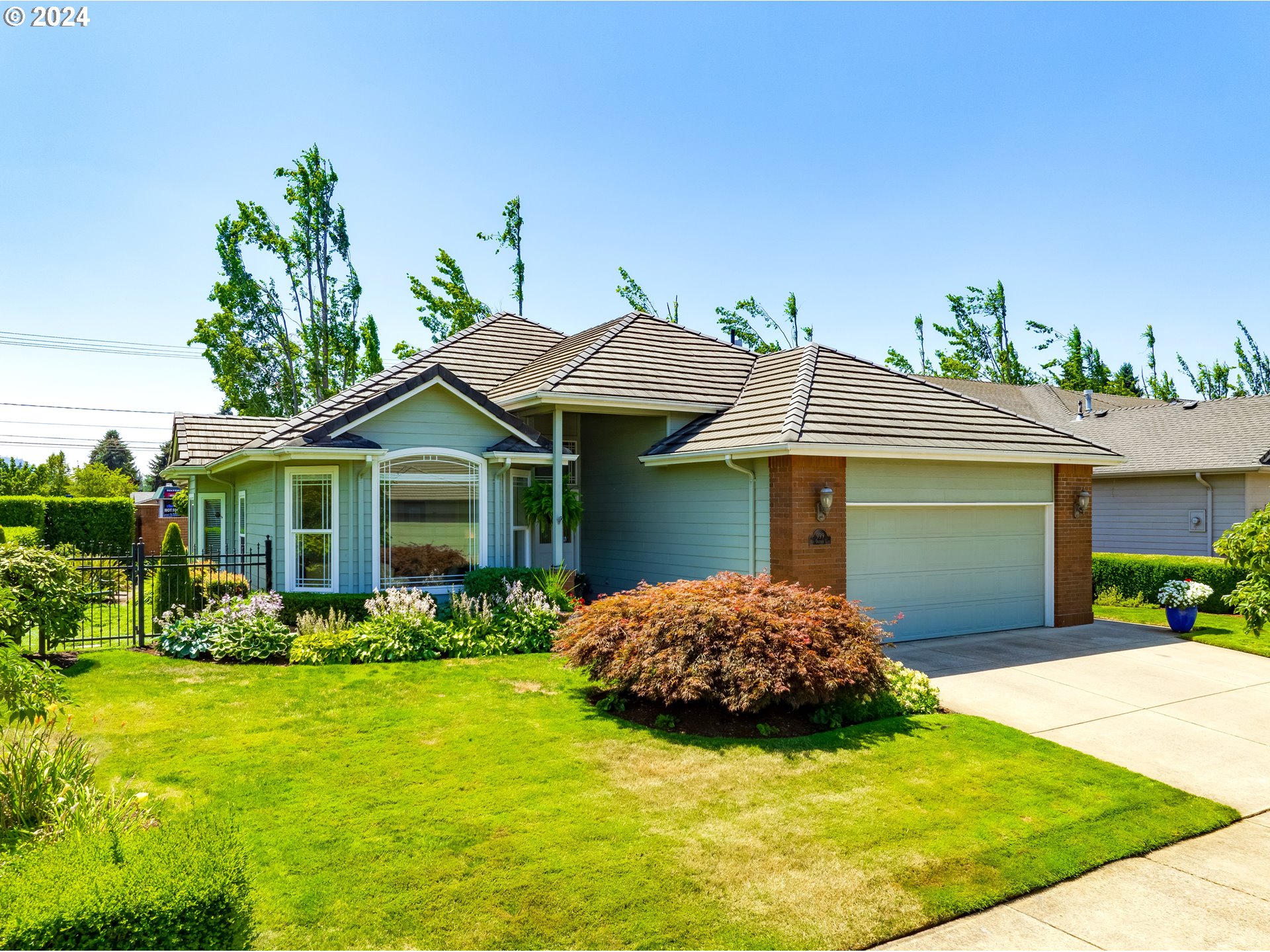 999 Old Orchard Lane Springfield, OR 97477 - Photo 1 of 34 a front view of a house with garden
