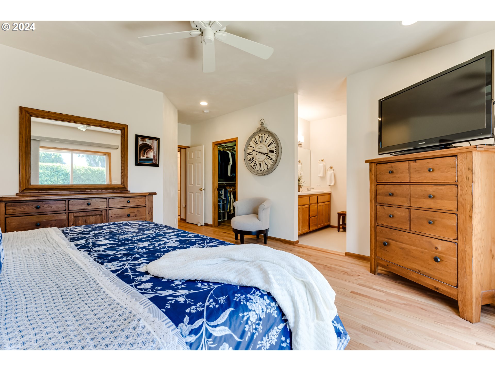999 Old Orchard Lane Springfield, OR 97477 - Photo 14 of 34 a bedroom with a bed and flat screen tv