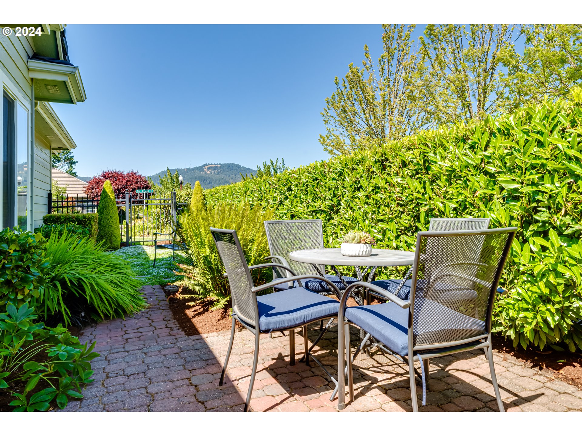999 Old Orchard Lane Springfield, OR 97477 - Photo 29 of 34 a view of a chairs and table in a backyard