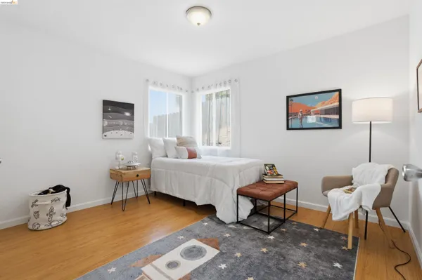 a bedroom with furniture and a window