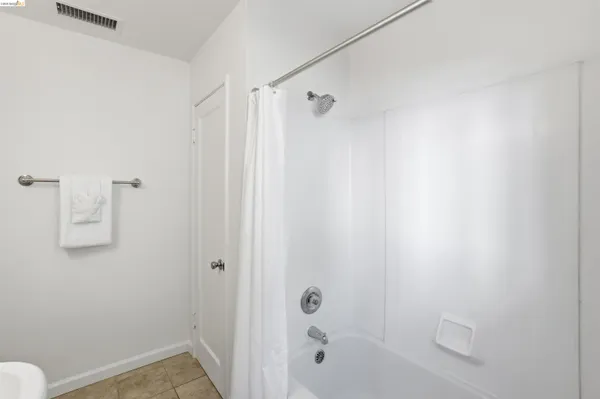 a bathroom with a shower and a toilet