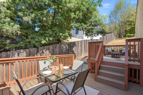 a view of balcony with wooden floor and outdoor seating