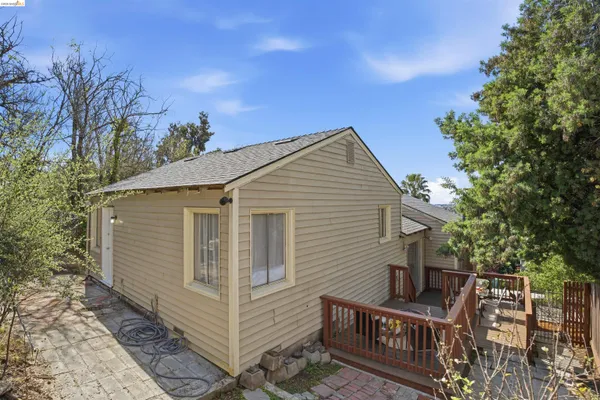 a view of a house with wooden fence