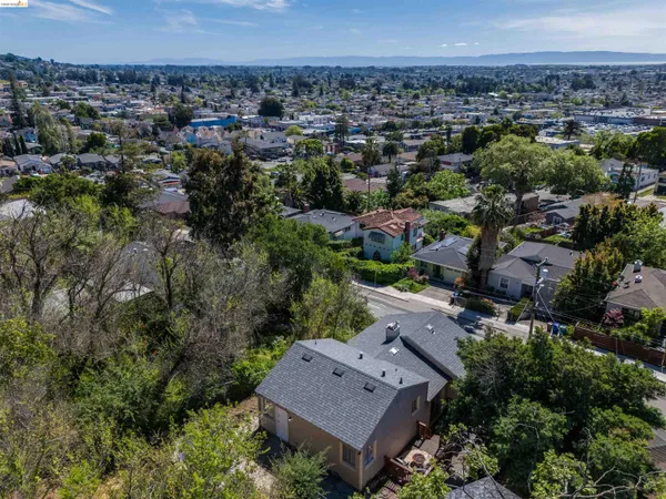 an aerial view of a house with a yard