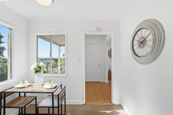 a view of a dining room with furniture and a window