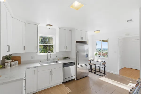 a kitchen with a sink cabinets and appliances