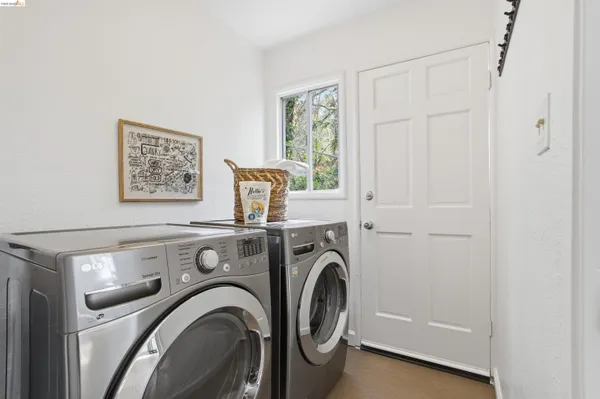 a view of storage and utility room with washer and dryer